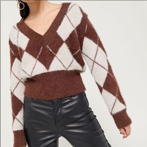 Sweater with detachable sleeves